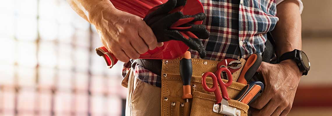 Essential home maintenance tools: wrench, hammer, screwdriver, and pliers. Trusted tools for quality repairs